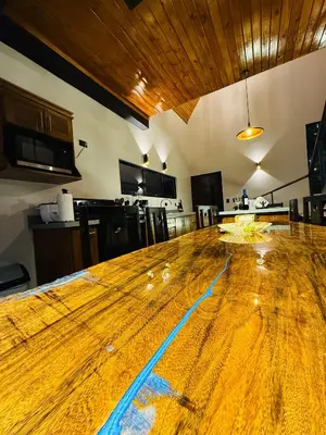 a large wooden table in the middle of a room at Cabañas de Montaña Magia del Poás in Poás