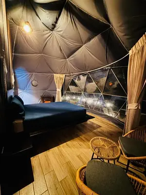 a room with a bed in a tent at Cabañas de Montaña Magia del Poás in Poás