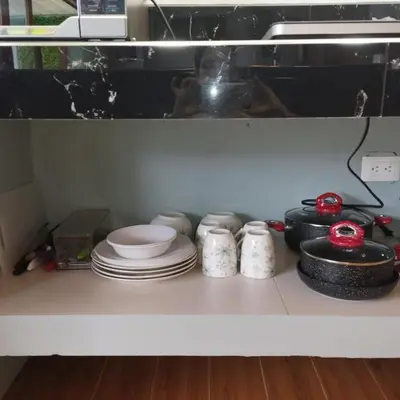 a kitchen counter with plates and dishes on it at Casa Luna in Tanque
