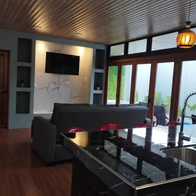 a living room with a couch and a table at Casa Luna in Tanque
