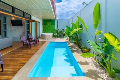 an infinity pool in the middle of a house with plants at Casa Luna in Tanque