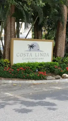 a sign for a costa lincimer communities at Jaco Costa Linda Condo in Jacó