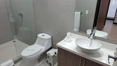 a bathroom with a toilet and a sink and a shower at Pop House with private pool at Ciudad del Mar in Jaco in Jacó