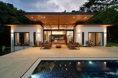a house with a pool in front of it at Villa Alba 4ensuite rooms ocean view Malpais in Mal País