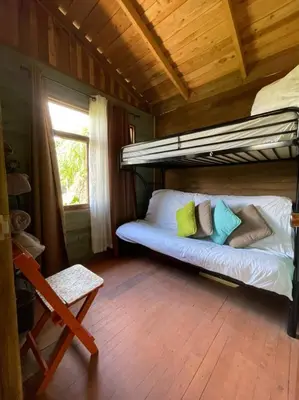 a bedroom with a bunk bed in a cabin at Cabaña de Montaña in Cartago