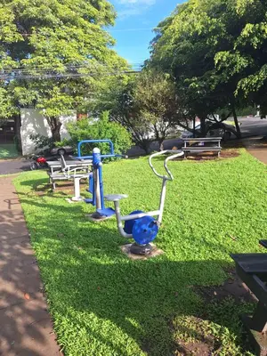 a park with a playground in the grass at Carolina Hostel in San José