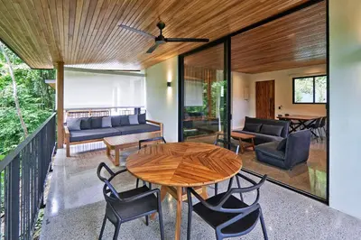 a living room with a wooden table and chairs at Casas Alba - 1 bedroom Loft private kitchen bathroom and terrace Malpais in Mal País