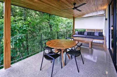 a room with a table and chairs on a balcony at Casas Alba - 1 bedroom Loft private kitchen bathroom and terrace Malpais in Mal País
