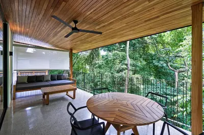 a screened in porch with a table and a couch at Casas Alba - 1 bedroom Loft private kitchen bathroom and terrace Malpais in Mal País