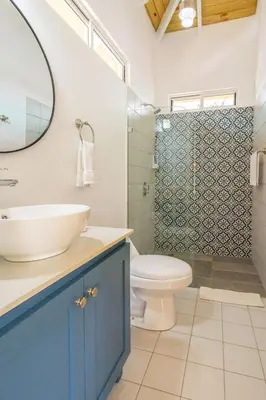a bathroom with a sink and a toilet and a shower at Cedrela Beach Villas in Uvita