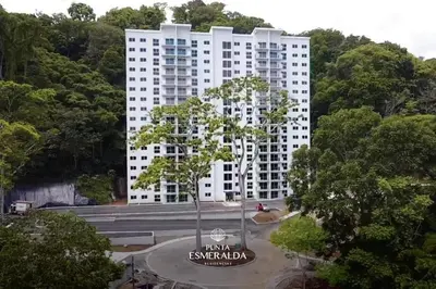 a tall white building in the middle of a park at Punta Esmeralda, Puntarenas Great Apartment in Quebrada Ganado