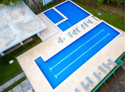 an empty swimming pool with blue paint on it at Punta Esmeralda, Puntarenas Great Apartment in Quebrada Ganado
