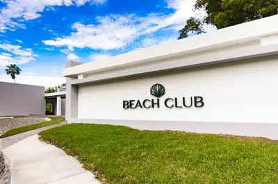 a beach club sign on the side of a building at Punta Esmeralda, Puntarenas Great Apartment in Quebrada Ganado