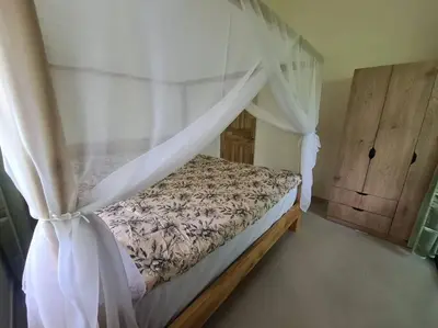 a bedroom with a bed with a canopy at Casa Lupa in San Rafael