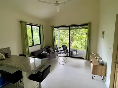 a living room with a kitchen and a living room with a table at Casa Lupa in San Rafael