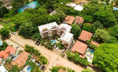 an overhead view of a village with houses and trees at Pipas Apartment in Tamarindo