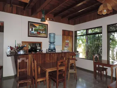 a dining room with a wooden table and chairs at Hotel Bell Bird in Monteverde Costa Rica