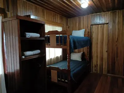 a bedroom with two bunk beds in a room at Hotel Bell Bird in Monteverde Costa Rica