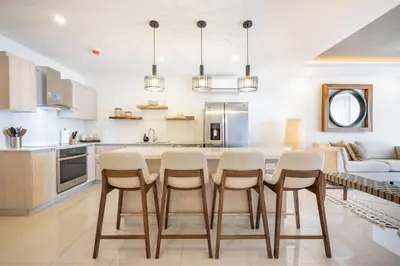 a kitchen with a table and chairs in a room at La Vista B8 in Tamarindo