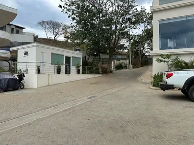 a white truck parked in front of a house at La Vista B8 in Tamarindo