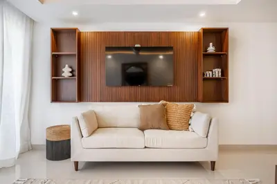 a living room with a couch and a tv at La Vista B8 in Tamarindo