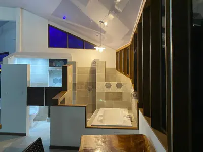 a bathroom with a tub and a toilet and a sink at Casa Aba Matapalo in Matapalo