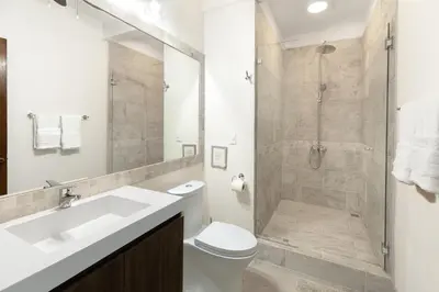 a bathroom with a shower and a toilet and a sink at Angels Sol Villa Hermosa 2b2b European Villa in Playa Hermosa