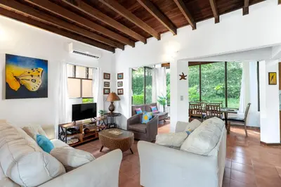 a living room with white furniture and a tv at Angels Sol Villa Hermosa 2b2b European Villa in Playa Hermosa