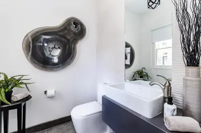a bathroom with a sink and a toilet at The Point Luxury Villa, Tamarindo in Tamarindo