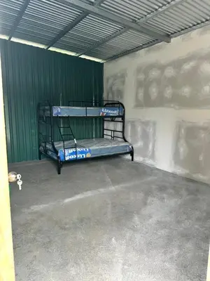 a room with two bunk beds in a wall at Camping El Fosforo in El Fosforo