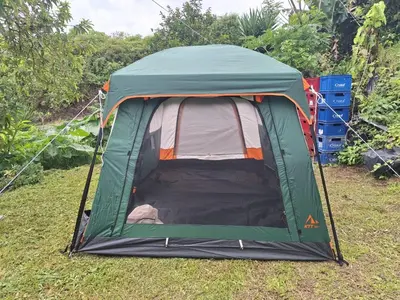 a green tent on the grass in a field at Camping El Fosforo in El Fosforo