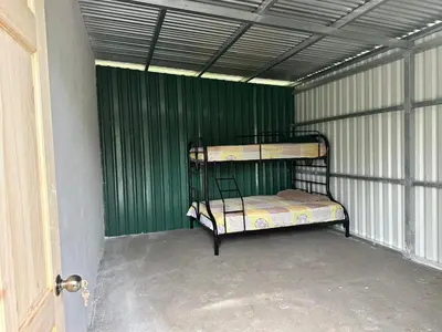 a bunk bed in a room with green walls at Camping El Fosforo in El Fosforo