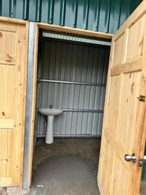 an open door to a bathroom with a sink at Camping El Fosforo in El Fosforo