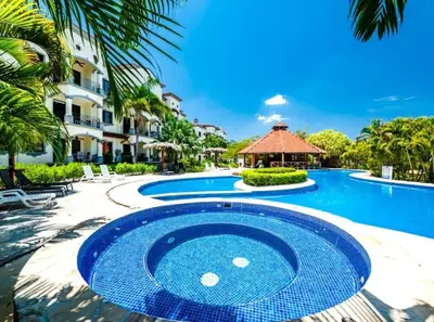 a pool at the resort with a gazebo at Palmas de Tamarindo Resort, 304E in Guanacaste