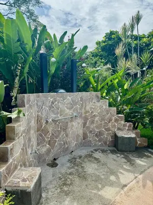 a stone bench sitting on top of a stone wall at Angels Mar Villa Hermosa 2b2b European Villa in Playa Hermosa