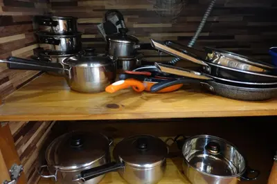 a wooden shelf with pots and pans and utensils at Angels Mar Villa Hermosa 2b2b European Villa in Playa Hermosa