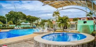 an image of a swimming pool at a resort at Enchanting 3 BR 2 Bath Condo in the Heart of Jaco in Jacó