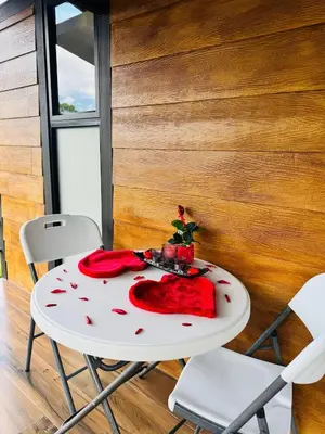 a white table with a red blanket on it at Cabañas La Hermosa #2 in Guápiles