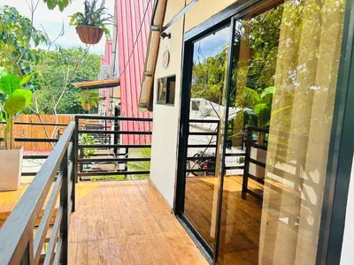 a glass door on a balcony with a view at Hotel en Huacas y Brasilito in Matapalo