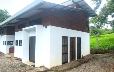 a rendering of a small house at Tiny Bosque del Barro in Barrio Jesús