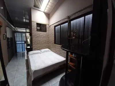 a bedroom with a bed in a room at Tita's House in Jarasal