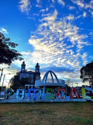 a playground in a park under a cloudy sky at Tita's House in Jarasal