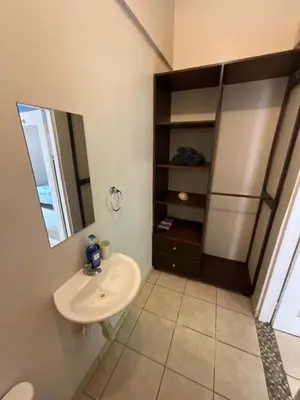 a bathroom with a sink and a mirror at Casitas de la Paz in Coco