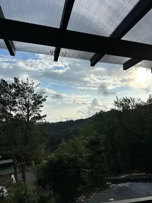 a view of a mountain with a solar roof at Nest Chalet Monteverde in Monteverde Costa Rica