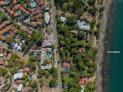 an aerial view of a house next to the water at Emerald Haven Second Floor Studio Mins from Beach in Coco