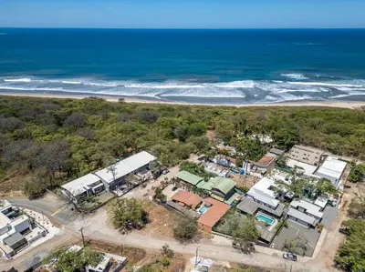 an aerial view of a house near the beach at Cozy Beachside Studio with Pool and Free WiFi in Playa Grande
