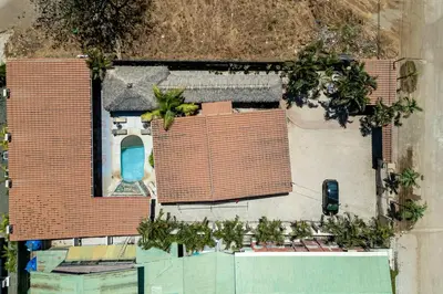 an aerial view of a house with a pool at Cozy Beachside Studio with Pool and Free WiFi in Playa Grande
