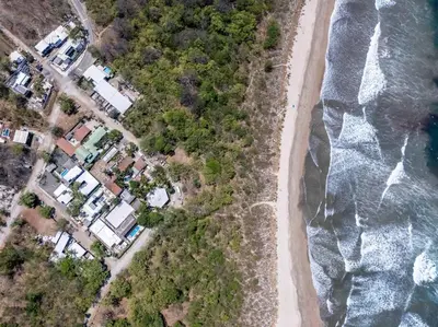 an overhead view of a beach and the ocean at Cozy Beachside Studio with Pool and Free WiFi in Playa Grande