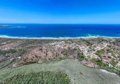 an aerial view of a beach and the ocean at Comfortable Vacation Home Steps from the Beach in Playa Grande