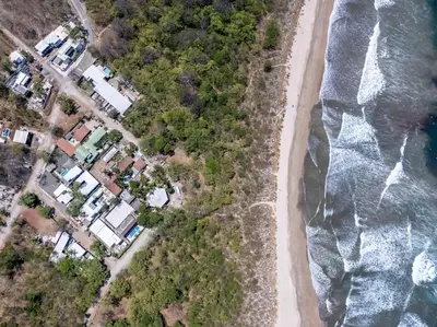 an overhead view of a beach and the ocean at Cozy Seaside Studio Perfect for Families in Playa Grande
